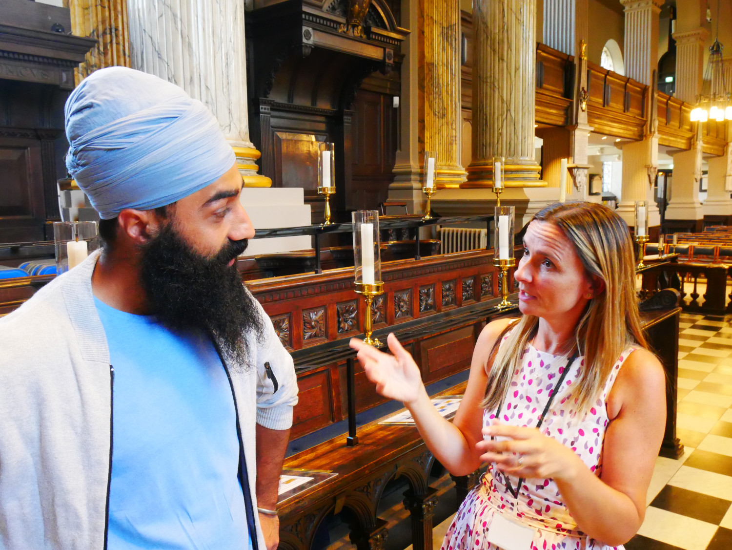 A Sikh man and a Christian woman talking together