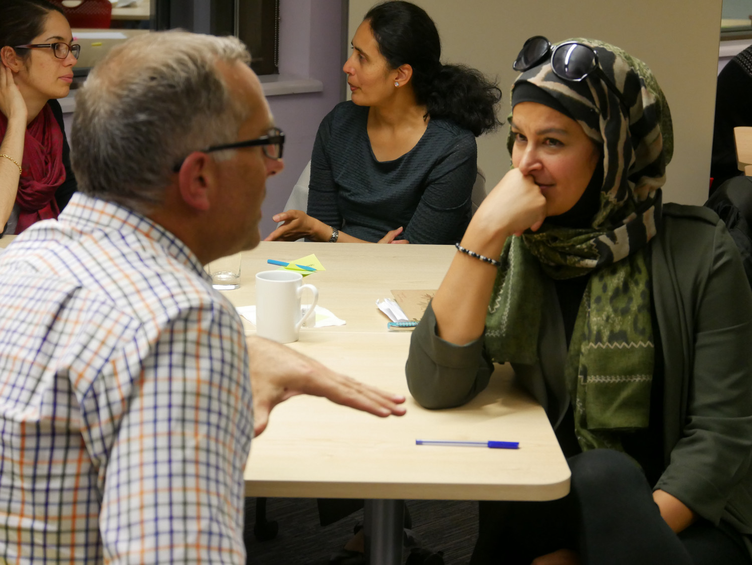 Christian man and Muslim woman talking