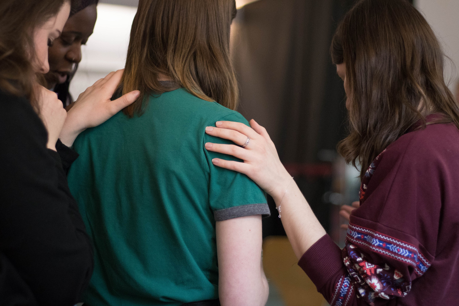 Image of women prayer with each other